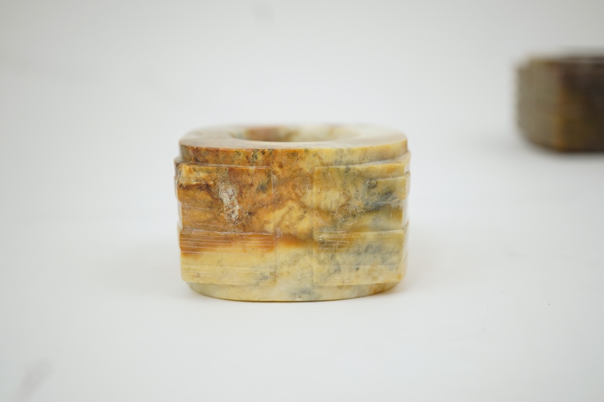 Four Chinese archaistic hardstone or burnt jade cong or cylinders